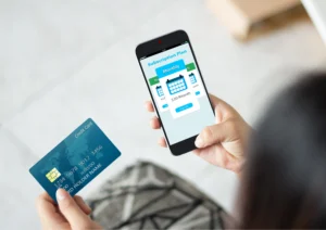 Image of a woman paying for a subscription plan on her mobile device