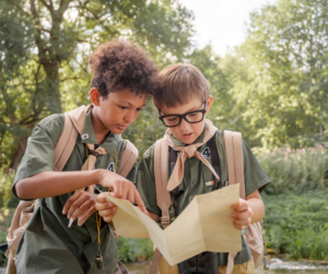 Image of two boys on a scavenger hunt at a fundraiser event